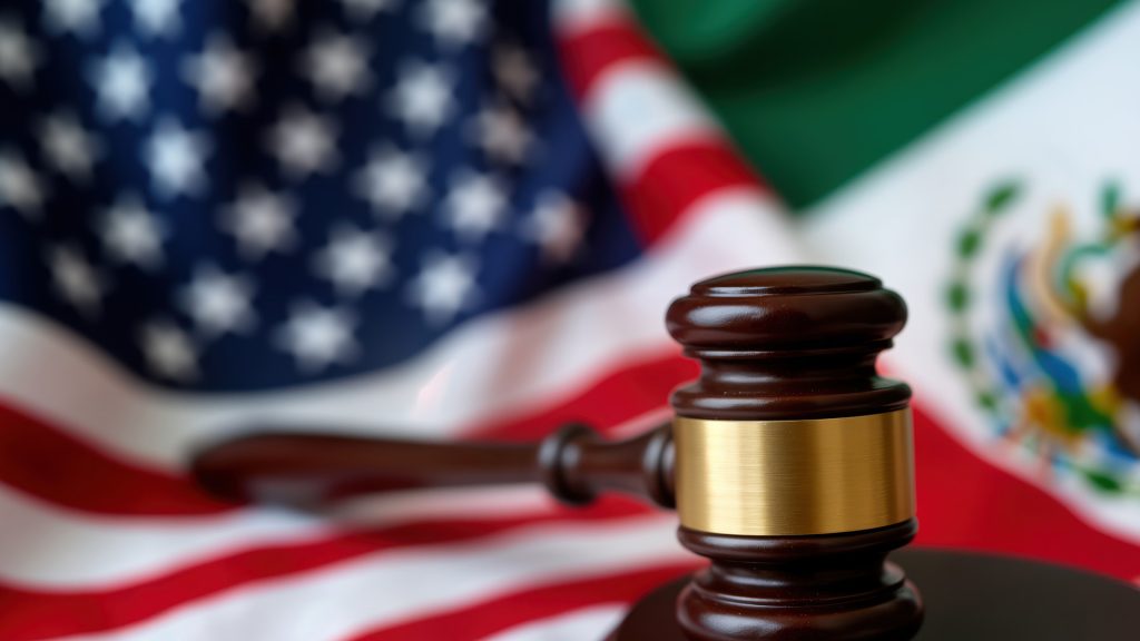 Deportation & Removal Defense Lawyer in Charlotte Immigration attorney defending a client in removal proceedings, reviewing documents in a Charlotte or Kinston office to prevent deportation and protect legal rights.
